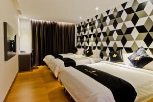 Postel nebo postele na pokoji v ubytování Mercury Boutique Hotel
