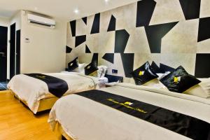 Postel nebo postele na pokoji v ubytování Mercury Boutique Hotel