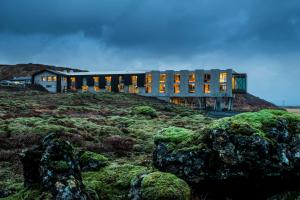 a building on top of a hill with moss at ION Adventure Hotel, Nesjavellir, a Member of Design Hotels in Nesjavellir