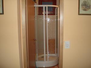 a shower with a glass door in a bathroom at APARTMA SABOTIČ in Sedula +21 photos