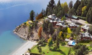 an aerial view of a house on an island in the water at Charming Luxury Lodge & Private Spa in San Carlos de Bariloche