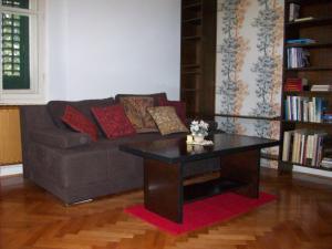 a living room with a couch and a coffee table at apartman Cedra in Izola