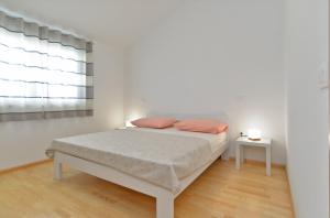 Postel nebo postele na pokoji v ubytování House Kazali 1749