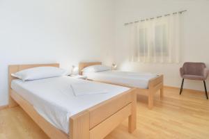 Postel nebo postele na pokoji v ubytování House Kazali 1749