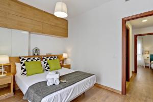Postel nebo postele na pokoji v ubytování Del Parque Flats - Ollerias 3