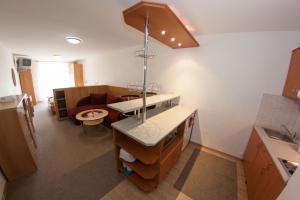 a kitchen with a sink and a counter top at Family Apartments Spiežovec in Donovaly +39 photos