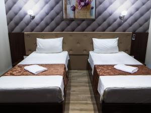 Een bed of bedden in een kamer bij AEN Hotel-Old City