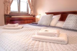 Postel nebo postele na pokoji v ubytování Hotel Buchlovice
