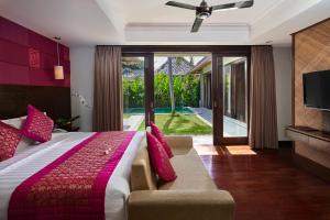 Ein Bett oder Betten in einem Zimmer der Unterkunft Mahagiri Villas Sanur