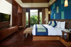 Ein Bett oder Betten in einem Zimmer der Unterkunft Mahagiri Villas Sanur