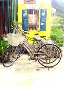 two bikes parked in front of a building at Green Garden Hoi An Homestay in Hoi An