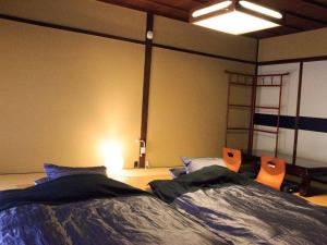 Katil atau katil-katil dalam bilik di 京都二条城近く京町屋120年の歴史に泊まる
