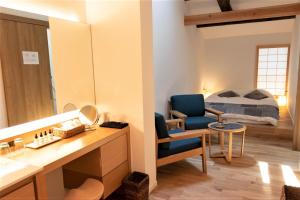Postel nebo postele na pokoji v ubytování Auberge AZABU