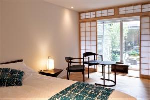 Postel nebo postele na pokoji v ubytování Auberge AZABU + 37 fotografií