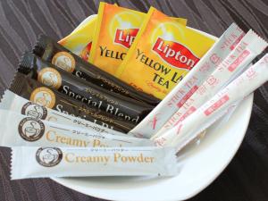 a pile of chocolate bars on a white plate at Hotel AreaOne Takamatsu in Takamatsu