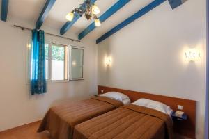 Postel nebo postele na pokoji v ubytování Résidence Cantu di Mare