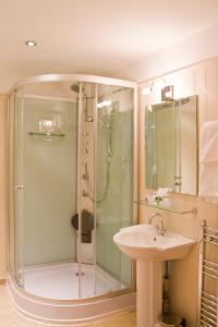 a bathroom with a shower and a sink at Duke Of Cornwall Hotel in Plymouth