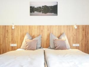 Ένα ή περισσότερα κρεβάτια σε δωμάτιο στο Hotel Birkensee