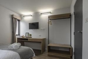 Postel nebo postele na pokoji v ubytování Carnation Residence + 30 fotografií