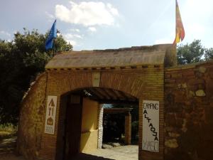 a brick building with two flags on top of it at Guara-Altaoja-Yaso in Yaso