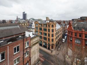 an aerial view of a city with buildings at Stay for longer on cheap rates 15 in Manchester
