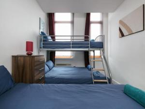 a bedroom with two beds and a bunk bed at Stay for longer on cheap rates 15 in Manchester