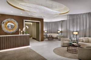 a lobby with a large chandelier in a hotel at Address Downtown in Dubai