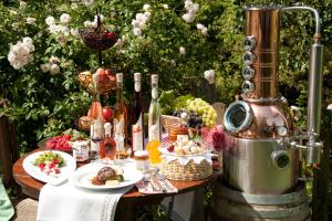 a table with plates of food and bottles of wine at Gasthof Restaurant Hirsch in Bad Ditzenbach