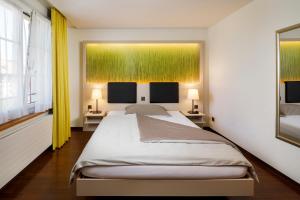 Postel nebo postele na pokoji v ubytování Hotel Jardin Bern