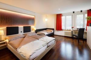 Postel nebo postele na pokoji v ubytování Hotel Jardin Bern