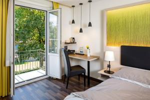 Postel nebo postele na pokoji v ubytování Hotel Jardin Bern