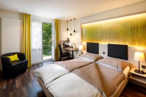 Postel nebo postele na pokoji v ubytování Hotel Jardin Bern + 37 fotografií