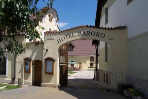 an entrance to a building with a sign that reads hotel baroda at Hotel Baroko in Prague