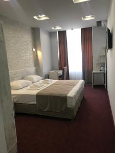 Postel nebo postele na pokoji v ubytování Hobby Hotel