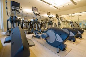 a gym with a bunch of treadmills and machines at Colonial Houses, an official Colonial Williamsburg Hotel in Williamsburg