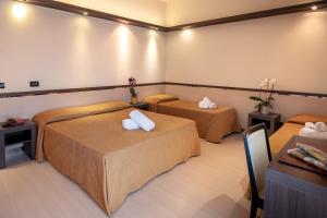Кровать или кровати в номере Hotel Mondial