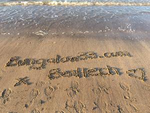 a message written in the sand on the beach at Bungalow33 Benllech in Benllech
