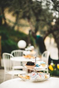 a table with plates of food on top of it at Amandolevanto B&B in Levanto