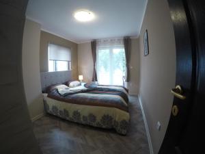 Ένα ή περισσότερα κρεβάτια σε δωμάτιο στο Apartman Bogić