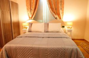 Postel nebo postele na pokoji v ubytování Lucca Relais