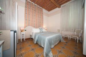 Postel nebo postele na pokoji v ubytování Lucca Relais