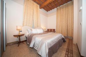 Postel nebo postele na pokoji v ubytování Lucca Relais