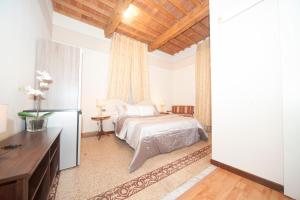 Postel nebo postele na pokoji v ubytování Lucca Relais