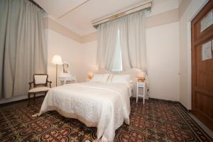 Postel nebo postele na pokoji v ubytování Lucca Relais