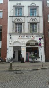 a large building with a clock on the front of it at Casa Mario in Bremen
