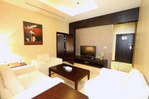 Télévision ou salle de divertissement dans l'établissement Nehal Hotel