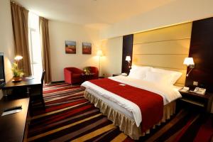 Un ou plusieurs lits dans un hébergement de l'établissement Nehal Hotel