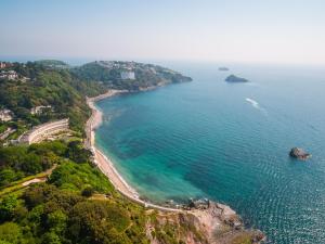 an aerial view of a beach and the ocean at The Osborne Apartments in Torquay