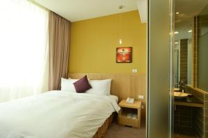 Postel nebo postele na pokoji v ubytování In Young Hotel