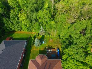 an overhead view of a house in the middle of a forest at Tucked Inn the Harbour B&B in Victoria Harbour